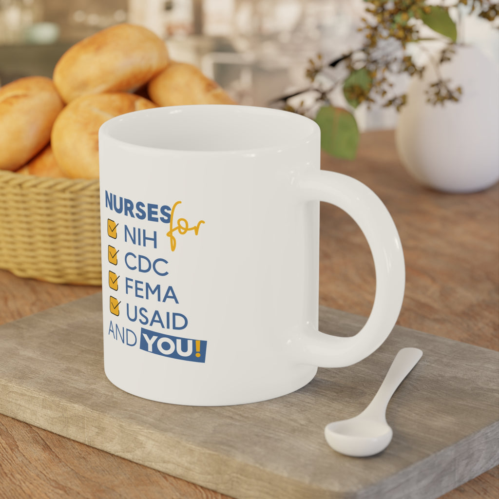 Unisex Ceramic Mug - Nurses Condemning Closure of USAID (right) - Nurses For NIH CDC FEMA USAID And YOU (left) - Durable white Ceramic - NFG-CM-ORCA