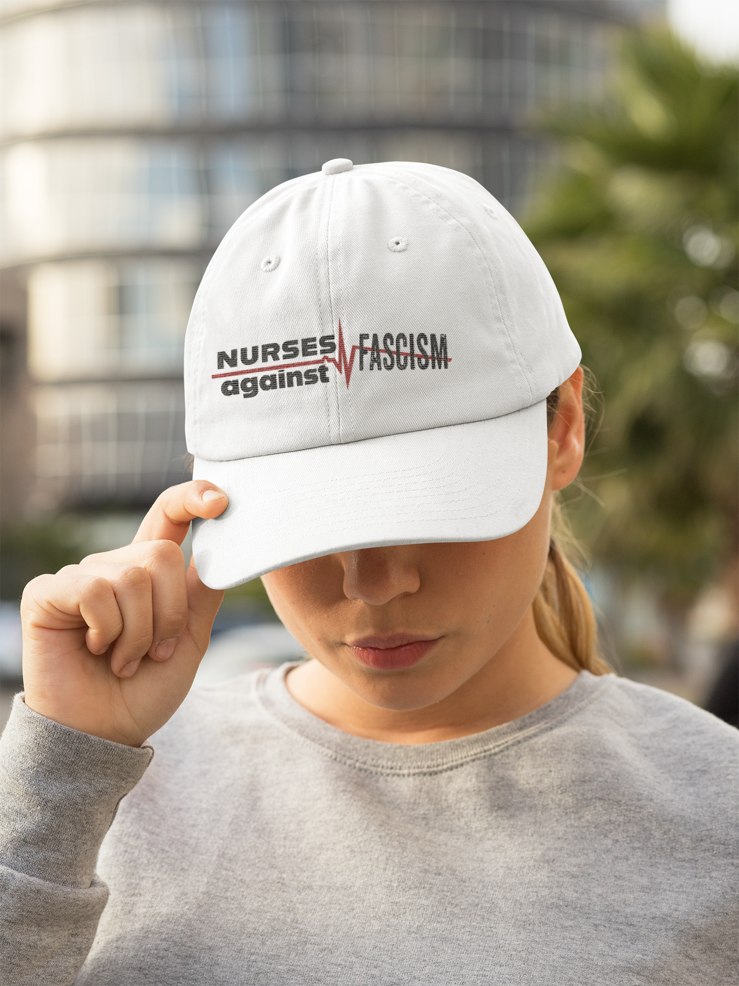 Women's Pigment-Dyed Cap - Nurses Against Fascism (front) - 100% cotton pigment-washed twill - NAF-DC-CASSIE