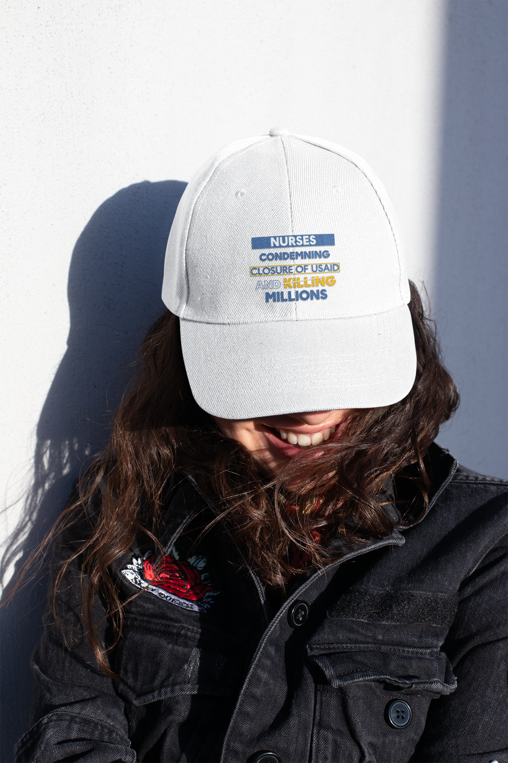 Women's Pigment-Dyed Cap - Nurses Condemning Closure of USAID (front) - 100% cotton pigment-washed twill - NFG-DC-CASSIE