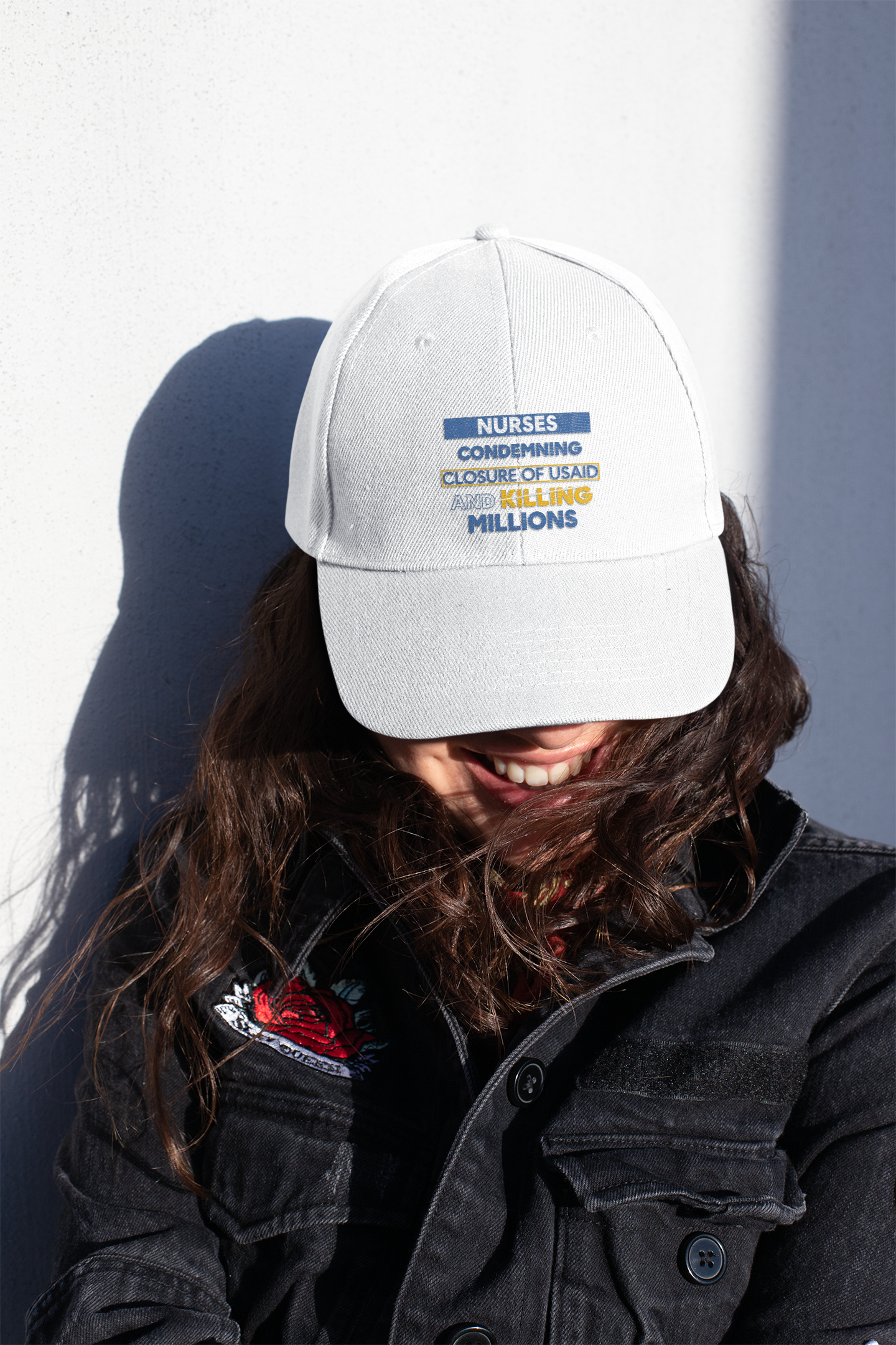 Women's Pigment-Dyed Cap - Nurses Condemning Closure of USAID (front) - 100% cotton pigment-washed twill - NFG-DC-CASSIE
