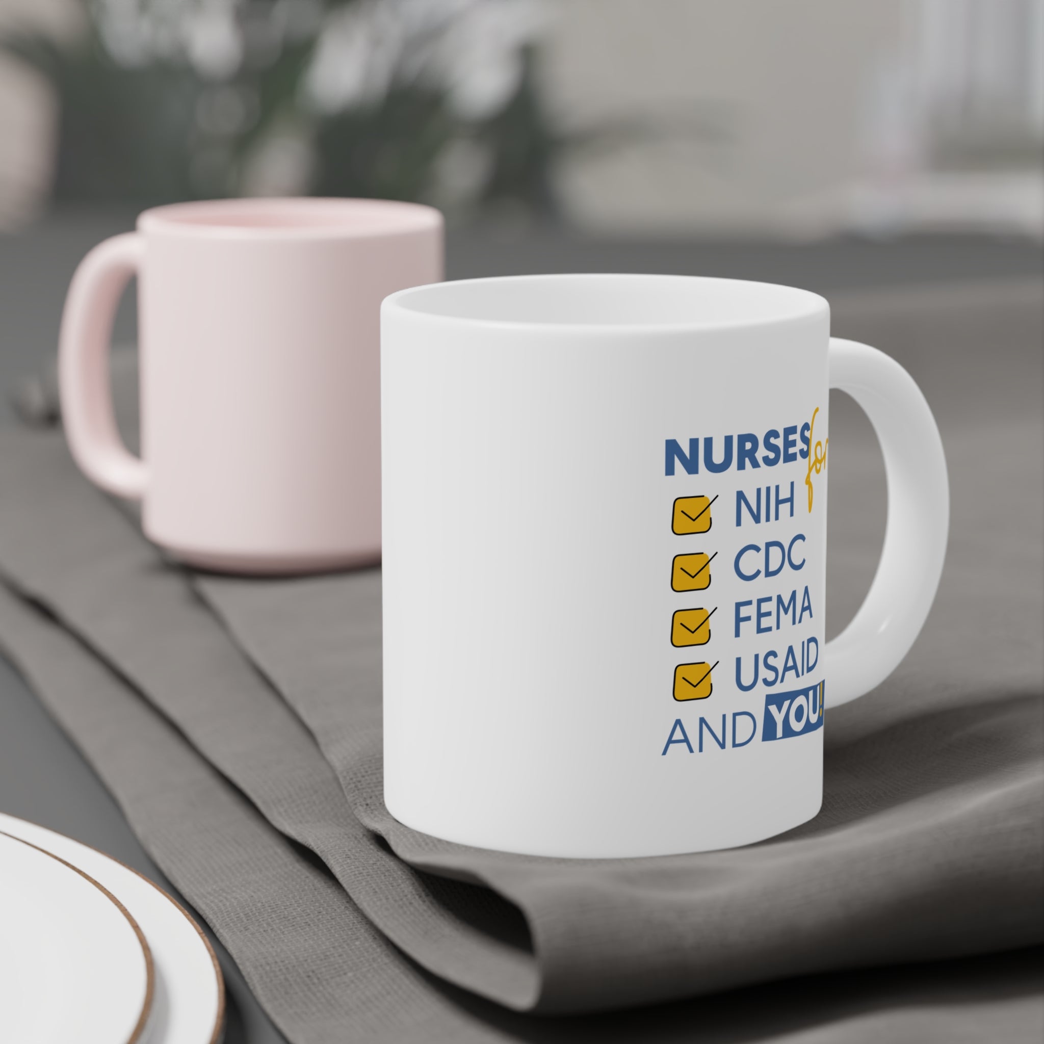 Unisex Ceramic Mug - Nurses Condemning Closure of USAID (right) - Nurses For NIH CDC FEMA USAID And YOU (left) - Durable white Ceramic - NFG-CM-ORCA